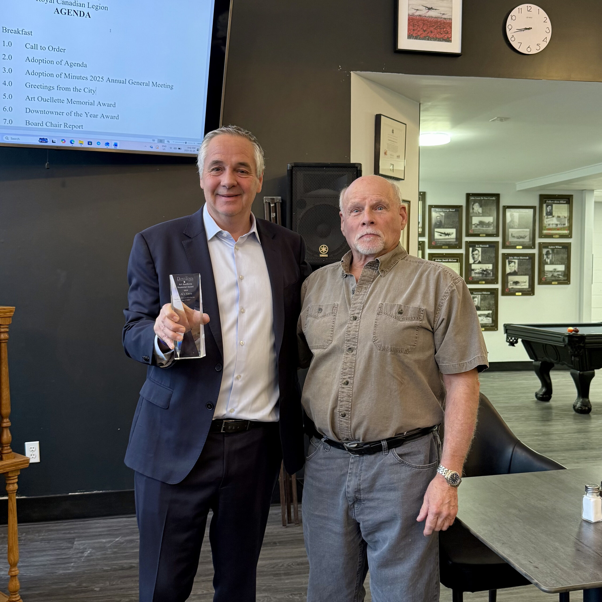Jim Goldsack of Al's News is presented with the Art Ouellette Memorial Award.